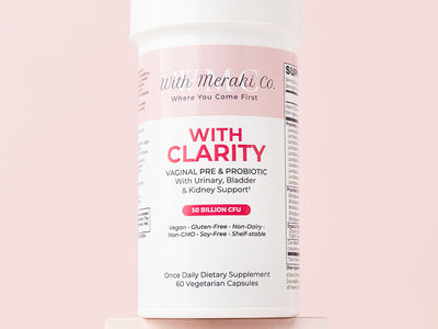 Supplement container labeled 'With Clarity' on a pink background