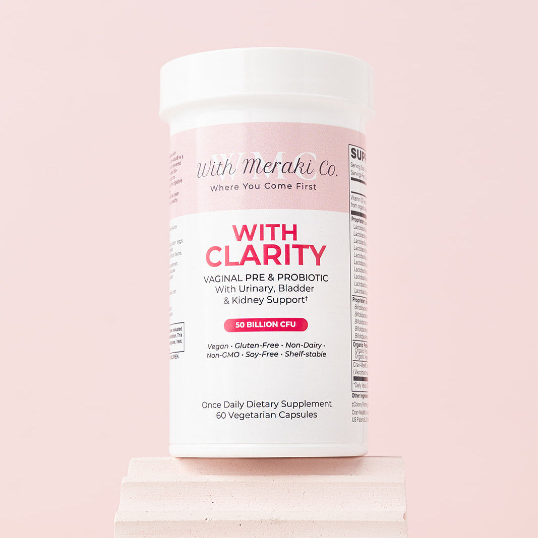 Supplement container labeled 'With Clarity' on a pink background
