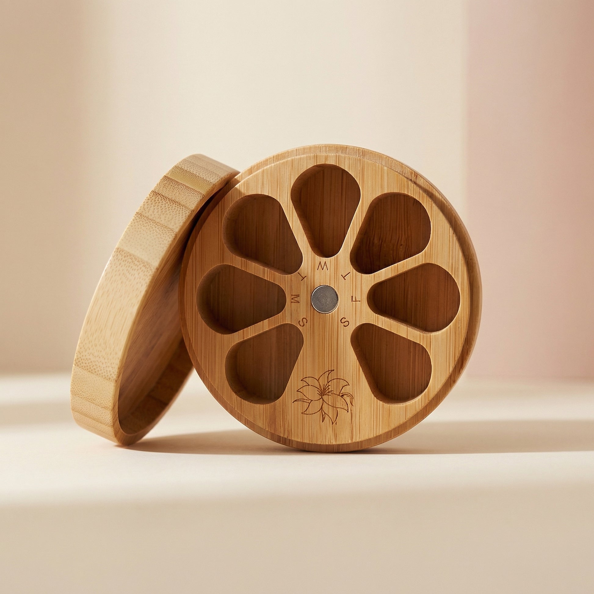 Wooden container with a lid on a beige background
